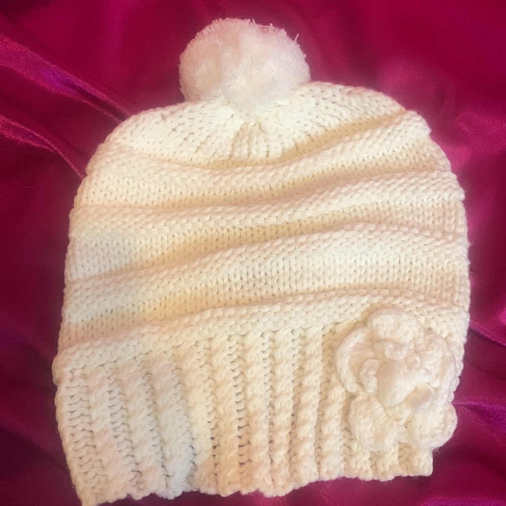 Brand new cream coloured toque never worn w/ pony tail hole in the back …